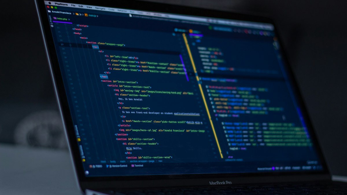 Software engineer monitoring website performance and conducting post-launch code maintenance